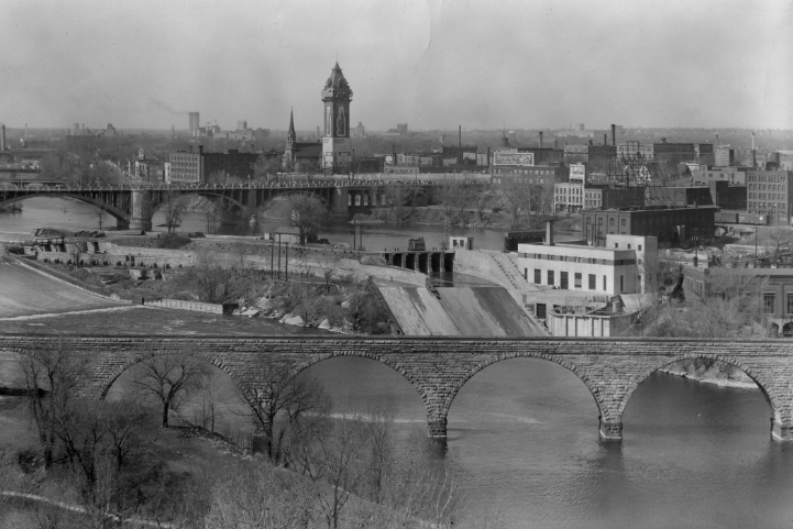 St. Anthony Falls lab with Stone Arch bridge in foreground, as seen in early 1900s