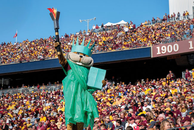Goldy dressed as Statue of Liberty at football game