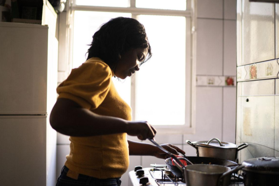 Woman cooking on a stovetop