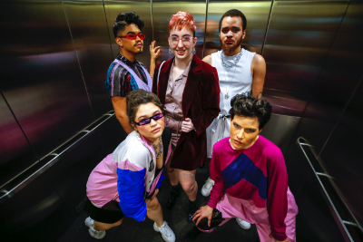 Student models in elevator before show