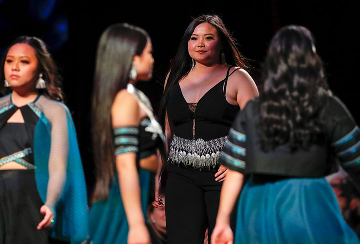 Models wearing styles by Mary Xiong, who wants to explore the impact she can make in the apparel industry as a Hmong American designer.