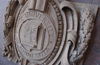 Stone relief of the U of M Regents seal