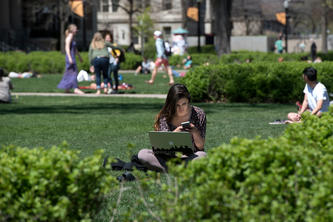Student studying outside with laptop