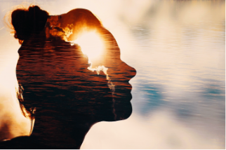 Silhouette of girl's head over sunset