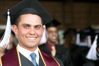 Man stands in graduation cap