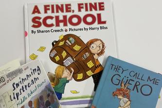 Image of three children's books about school. 