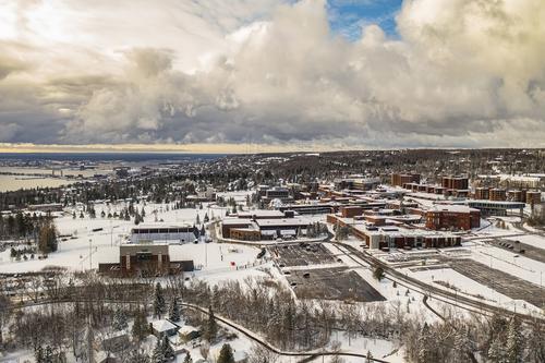 Aerial shot of the snow-covered Duluth campus.