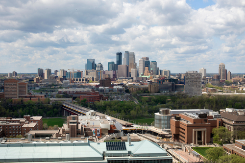 The Minneapolis skyline stands out on the horizon beyond the edges of the University's east bank campus
