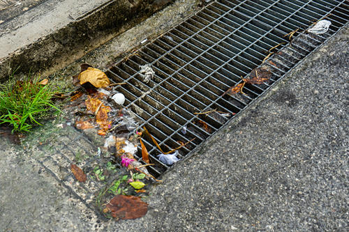 street drain with garbage