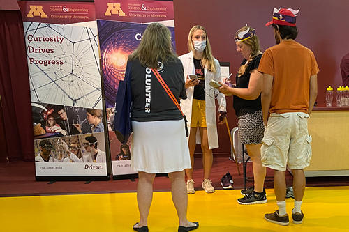 Cara Herbers, in mask, talks to people at the 2021 Minnesota State Fair. 