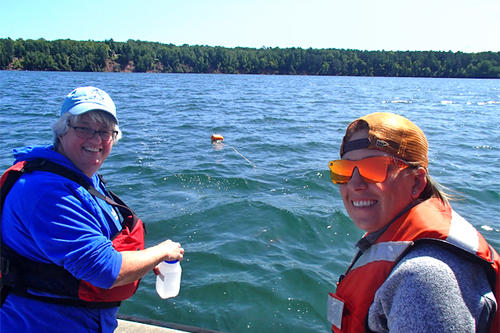 Photo of U of M researchers collecting water samples.
