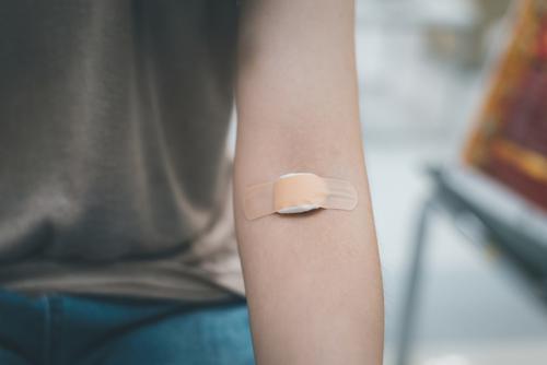 Stock image of arm with bandage.