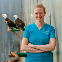 Dana Franzen-Klein with two bald eagles in background