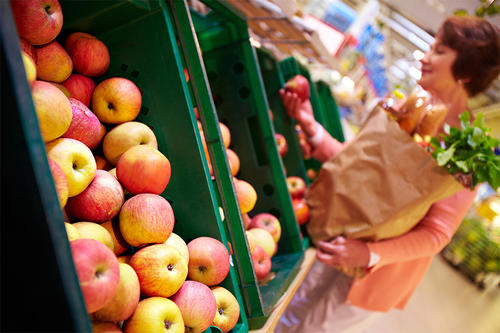 Woman browsing fruit at grocery store