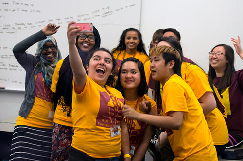 A group of students take a selfie during the multicultural student leadership retreat.
