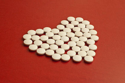 A heart shape made out of small white pills