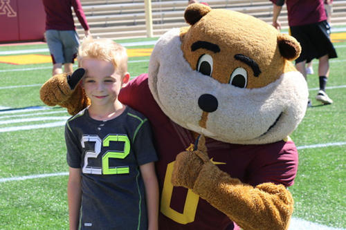 A young boy poses with Goldy Gopher at the HopeDay Festival.