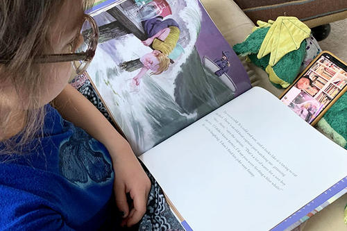 Child reading a picture book