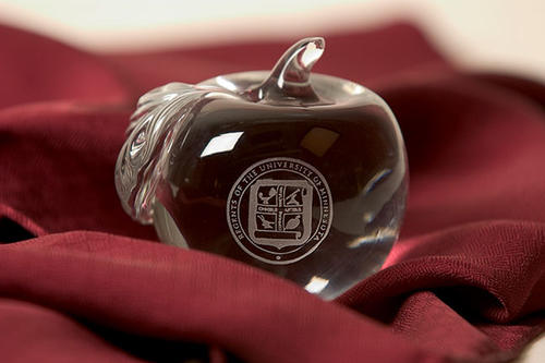 Glass apple with university seal