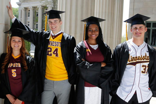Gopher student-athletes pose in graduation gowns.