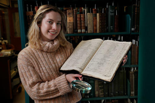 Louisa Botten with a manuscript 