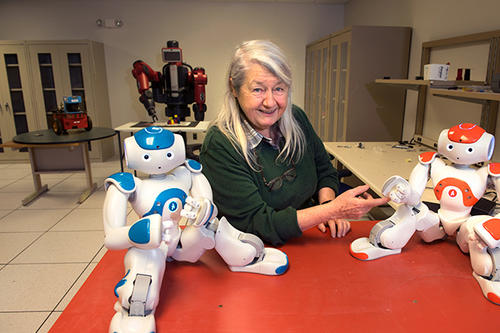 Maria L. Gini, with humanoid robots.