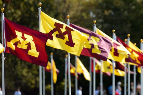 Maroon and gold M flags flapping in the breeze