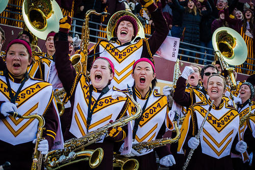 Members of the University of Minnesota Marching Band exult.