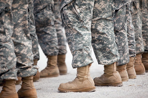 Military boots standing in line.