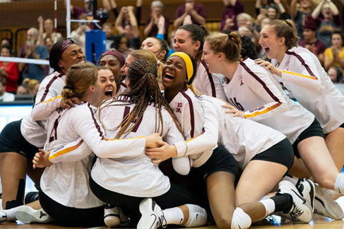 The Minnesota volleyball team celebrates after beating Louisville in three sets to advance to the Final Four.