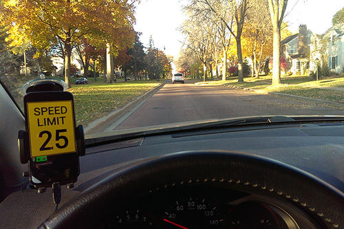 The Teen Driver Support System device on the dash of a car in motion.