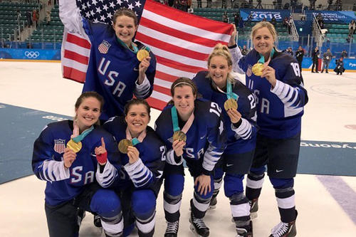 The six former and current Golden Gophers display their gold medals after Team USA&#039;s victory over Canada.