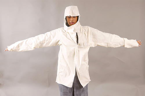 Warda Moosa wearing an electromagnetic-field-shielding fabric that blocks signals that may interfere with a broadcast beacon.