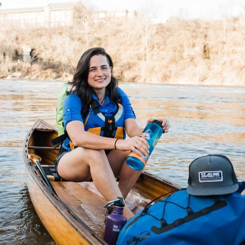 Student researcher Natalie Warren in a canoe on Mississippi river
