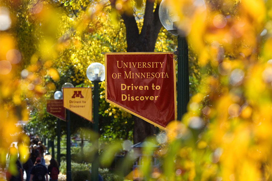 umn banner hanging off lamp post on campus