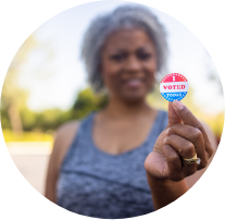 Person holding “I Voted” sticker