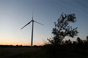 animated image of turbine spinning at sunset